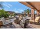 Relaxing patio with fire pit and comfortable seating at 2625 W Desert Hills Dr, Phoenix, AZ 85086
