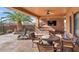 Outdoor kitchen and dining area under covered patio at 2625 W Desert Hills Dr, Phoenix, AZ 85086