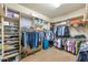 Large walk-in closet with ample shelving and hanging space at 2625 W Desert Hills Dr, Phoenix, AZ 85086