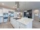 Bright, open kitchen featuring stainless steel appliances, an oversized island, and pendant lighting at 290 E Tangerine Path, Queen Creek, AZ 85140