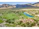 Aerial view of community with golf course and mountains at 3205 S Ponderosa Dr, Gold Canyon, AZ 85118