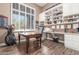 Home office features built-in shelving and wood desk at 3205 S Ponderosa Dr, Gold Canyon, AZ 85118