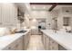Modern kitchen with white cabinets and center island at 3205 S Ponderosa Dr, Gold Canyon, AZ 85118