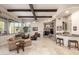 Open living area with stone fireplace and wet bar at 3205 S Ponderosa Dr, Gold Canyon, AZ 85118