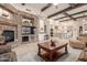 Spacious living room showcasing a stone fireplace and high ceilings at 3205 S Ponderosa Dr, Gold Canyon, AZ 85118