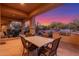 Spacious patio with dining area and stunning sunset views at 3205 S Ponderosa Dr, Gold Canyon, AZ 85118
