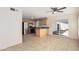 Kitchen boasts stainless steel appliances and wood cabinets at 3719 W Acoma Dr, Phoenix, AZ 85053