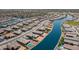 Aerial view of a lakefront community with modern homes and lush landscaping at 40365 W Haley Dr, Maricopa, AZ 85138