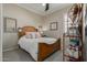 Cozy bedroom with wooden bed frame and adjacent shelving at 41688 W Cribbage Rd, Maricopa, AZ 85138