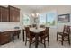 Kitchen with breakfast nook and view to the backyard at 41688 W Cribbage Rd, Maricopa, AZ 85138