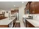 Modern kitchen with stainless steel appliances and light colored cabinetry at 41688 W Cribbage Rd, Maricopa, AZ 85138