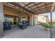 Relaxing patio with pergola, seating area, and fire pit at 41688 W Cribbage Rd, Maricopa, AZ 85138