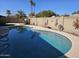 Relaxing kidney shaped pool with decorative accents at 514 E Gabrilla Dr, Casa Grande, AZ 85122