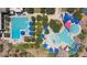 Aerial view of the community pool and park, complete with waterslides and a splashpad at 6546 W Georgetown Way, Florence, AZ 85132