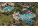 Aerial view of the community pool area, with pool slides, splashpad, and multiple pools at 6546 W Georgetown Way, Florence, AZ 85132