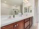 Well-lit bathroom features dual sinks, granite countertops, and plenty of cabinet space at 6546 W Georgetown Way, Florence, AZ 85132