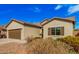 Well-maintained single-story home with desert landscaping and a convenient two-car garage at 6546 W Georgetown Way, Florence, AZ 85132