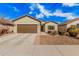 Inviting single-story home with desert landscaping, a two-car garage, and a brick-lined walkway at 6546 W Georgetown Way, Florence, AZ 85132