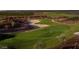 A lush green golf course with sand traps offers a challenging and scenic recreational experience at 6546 W Georgetown Way, Florence, AZ 85132