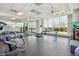 Well-equipped gym with weight training machines, free weights, and mirrored walls at 6546 W Georgetown Way, Florence, AZ 85132