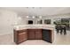 Open-concept kitchen featuring granite countertops, stainless steel sink, and seamless flow to the living area at 6546 W Georgetown Way, Florence, AZ 85132
