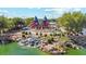 Aerial view of the community playground with water features and lush landscaping at 6546 W Georgetown Way, Florence, AZ 85132