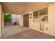 Covered patio with brick pavers and access to backyard at 7046 W Mercer Ln, Peoria, AZ 85345