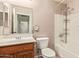 Clean bathroom with single sink vanity and bathtub at 7046 W Mercer Ln, Peoria, AZ 85345