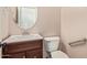 Clean bathroom with vanity, toilet and grab bar at 7046 W Mercer Ln, Peoria, AZ 85345