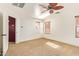Bright bedroom with ceiling fan and ample closet space at 7046 W Mercer Ln, Peoria, AZ 85345