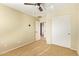 Simple bedroom with ceiling fan and double door closet at 7046 W Mercer Ln, Peoria, AZ 85345