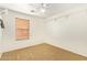 Simple bedroom with ceiling fan and window coverings at 7046 W Mercer Ln, Peoria, AZ 85345