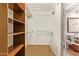 Spacious closet with built-in shelving and rods at 7046 W Mercer Ln, Peoria, AZ 85345