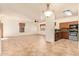 Open kitchen with granite countertops and stainless steel appliances at 7046 W Mercer Ln, Peoria, AZ 85345