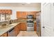 Stylish kitchen with granite countertops and wood cabinets at 7046 W Mercer Ln, Peoria, AZ 85345
