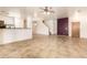 Bright living room with tile floors and staircase at 7046 W Mercer Ln, Peoria, AZ 85345