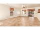 Spacious living room with tile floors and a sliding glass door at 7046 W Mercer Ln, Peoria, AZ 85345