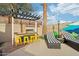 Outdoor kitchen, lounge chairs, and pergola create a relaxing backyard oasis at 8214 E Northland Dr, Scottsdale, AZ 85251
