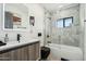 Modern bathroom with marble tile, a bathtub, and a sleek vanity at 8214 E Northland Dr, Scottsdale, AZ 85251