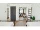 Room with twin beds and mirror sliding doors reflecting the room at 8214 E Northland Dr, Scottsdale, AZ 85251