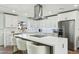 Open dining area with modern chandelier and built-in bar at 8214 E Northland Dr, Scottsdale, AZ 85251