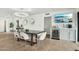 Modern kitchen with white cabinets, large island, and stainless steel appliances at 8214 E Northland Dr, Scottsdale, AZ 85251