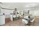 Modern white kitchen with large island and stainless steel appliances at 8214 E Northland Dr, Scottsdale, AZ 85251