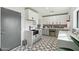 Stylish laundry room with modern gray cabinets and geometric tile floor at 8214 E Northland Dr, Scottsdale, AZ 85251