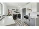 Updated laundry room featuring black farmhouse sink and contemporary design at 8214 E Northland Dr, Scottsdale, AZ 85251