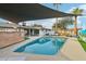 Relaxing pool area with patio furniture under a shade sail at 8214 E Northland Dr, Scottsdale, AZ 85251