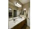 Double vanity bathroom with large mirror and light at 861 E Toledo St, Gilbert, AZ 85295