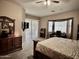 Bedroom featuring a sliding glass door, TV, and a dedicated desk area with natural light at 861 E Toledo St, Gilbert, AZ 85295