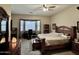 Spacious bedroom featuring a ceiling fan and dedicated desk area with natural light at 861 E Toledo St, Gilbert, AZ 85295