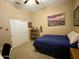 Cozy bedroom with double bed and city view art at 861 E Toledo St, Gilbert, AZ 85295